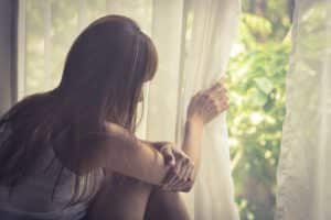 tips for social anxiety girl looking out of window